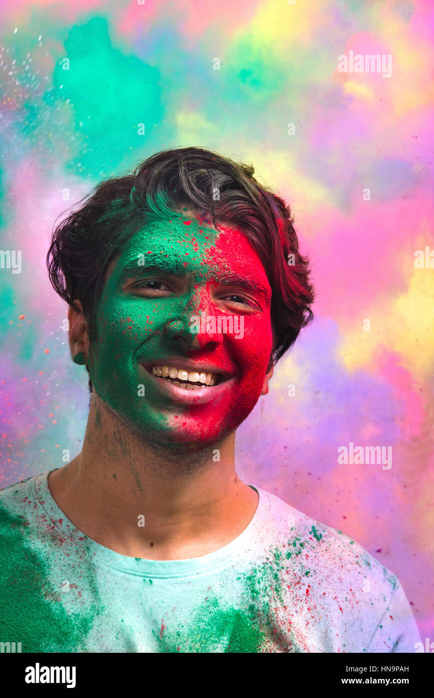 Portrait Of Young Man With Paint On Face During Holi Stock Photo Alamy