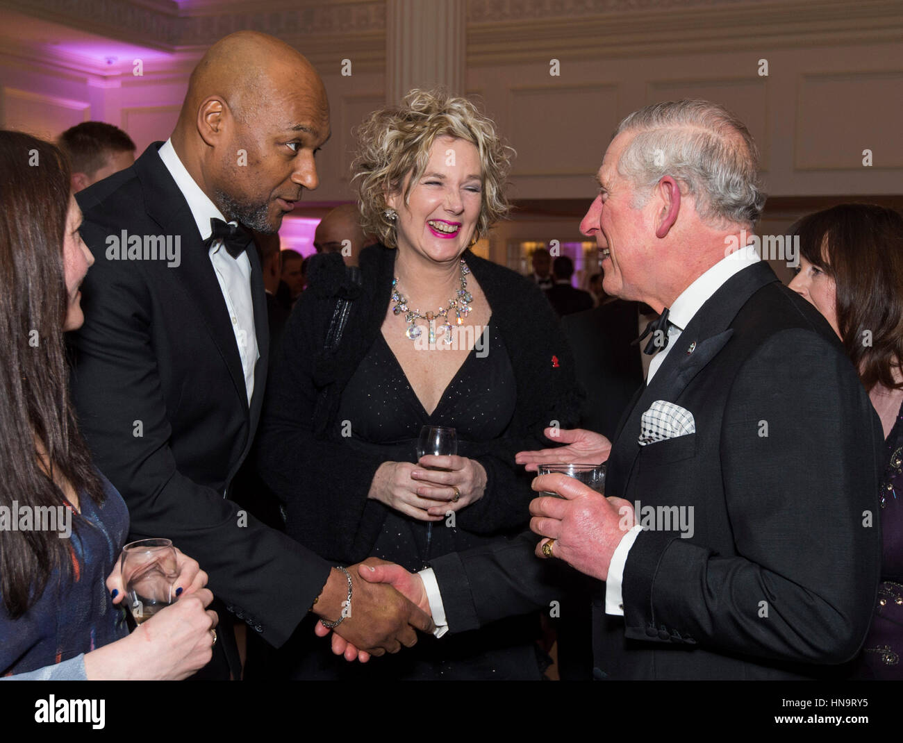 The Prince of Wales speaks to Colin Salmon as he attends the annual Prince's Trust 'Invest In Futures' reception at The Savoy Hotel in London, where he met the charity's ambassadors, supporters and beneficiaries. Stock Photo
