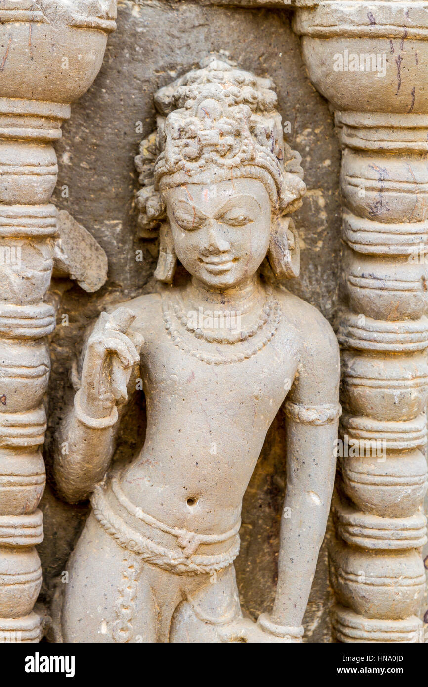 A carving of an Apsara (heavenly nymph) at the Chand Baori stepwell in Abhaneri, Rajasthan, India. Stock Photo