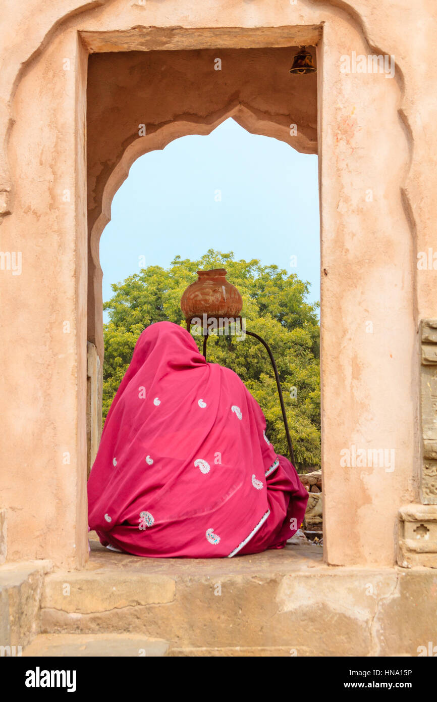 Abhaneri, India, 21st January 2017 -A Hindu Woman worshipping a Shiva Lingam at the Harshat Mata Temple in Abhaneri, Rajasthan, India. Stock Photo