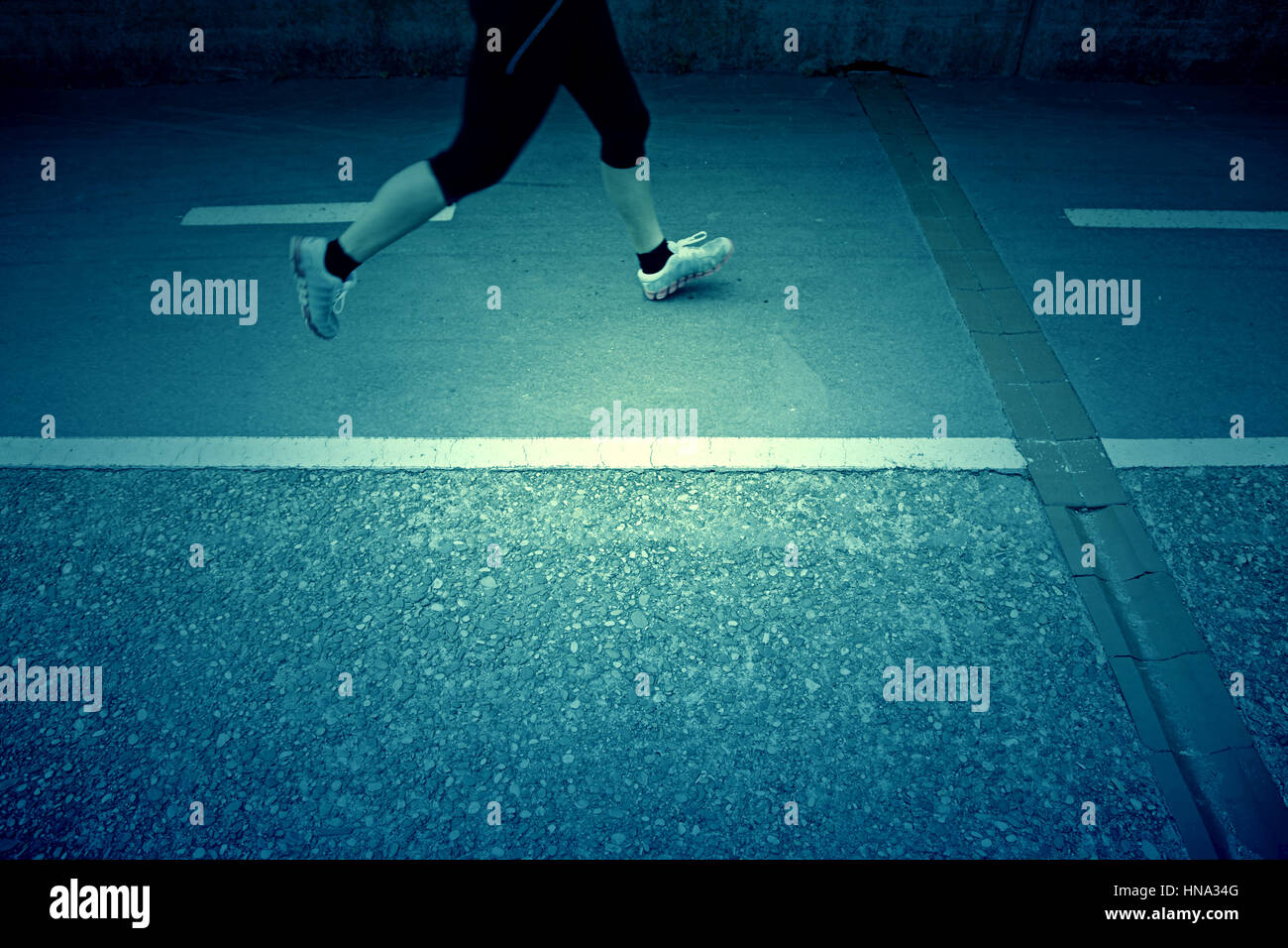 Woman running, detail of a woman jogging in the city, urban sport Stock