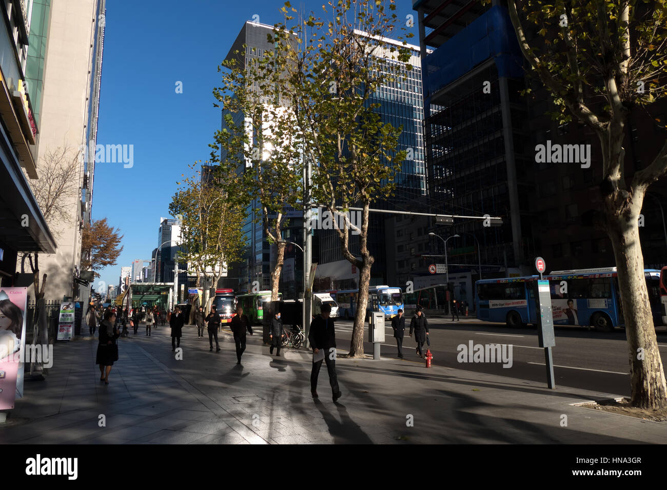 View of Gangnam-daero Avenue in Gangnam district, Seoul, South Korea, Asia. Traffic, cars, buses, people walking, commuters, rush hour in the morning Stock Photo
