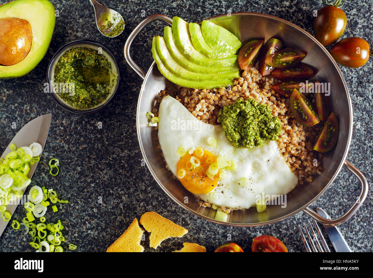 fried Eggs and Avocado in pan Stock Photo Alamy