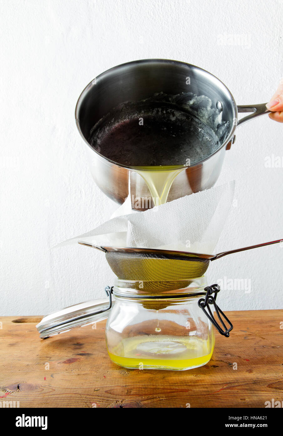 preparation of butter Ghee . filtering Stock Photo - Alamy