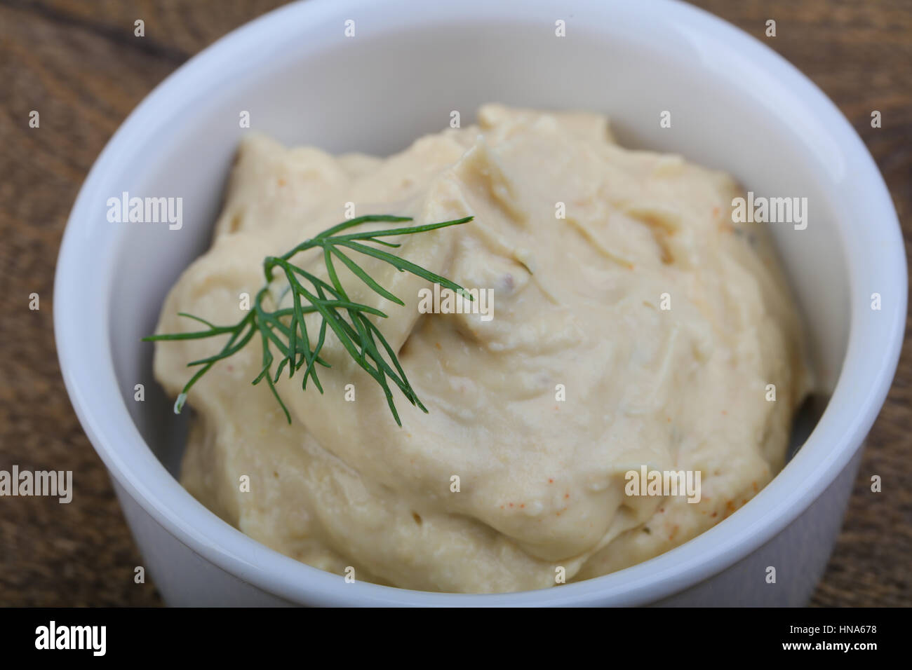Arabic traditional cusine hummus with dill and cedar nuts Stock Photo