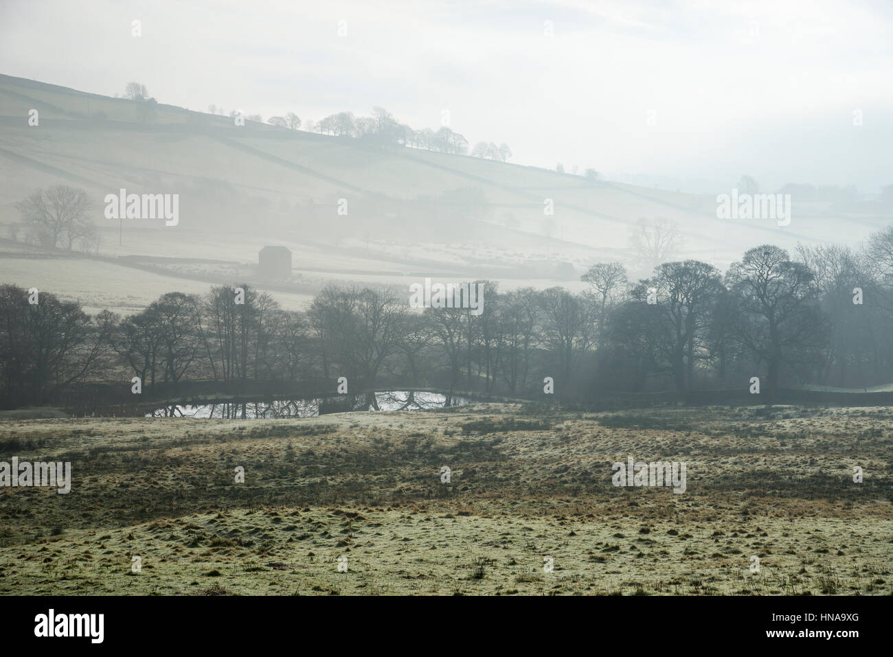A misty winter morning in the English countryside Stock Photo