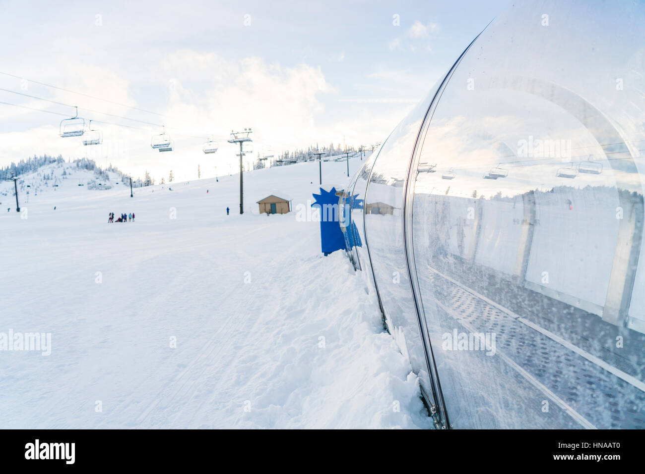 carpet lift in ski resort with snow mountain background Stock Photo - Alamy
