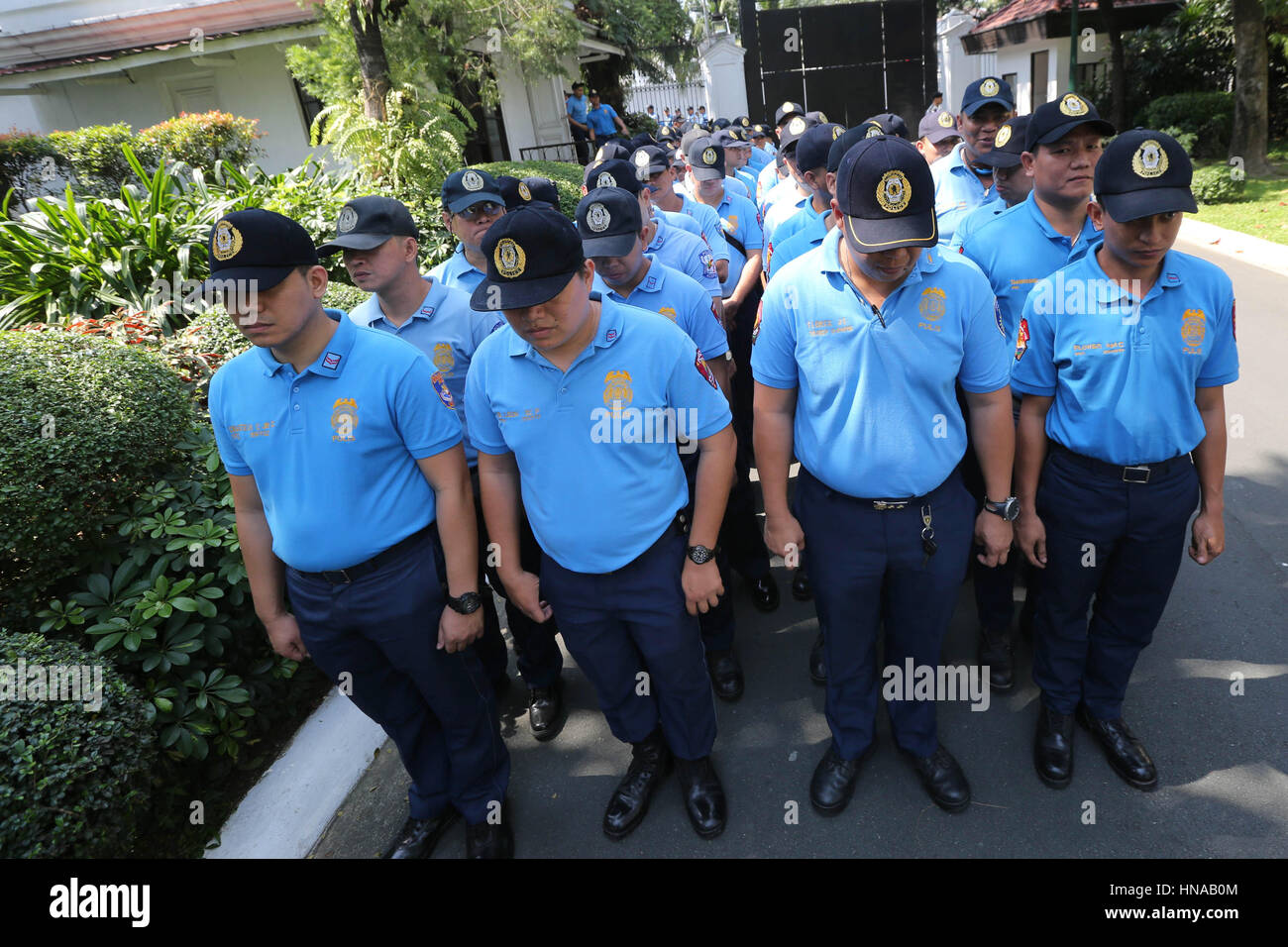 Corrupt police officers facing charges of various crimes line up before being resigned to Basilan Island for two years at the Malacanang Palace February 7, 2017 in Manila, Philippines. President Rodrigo Duterte gave the errant cops 15 days to decide whether to resign or accept their re-assignment. Stock Photo