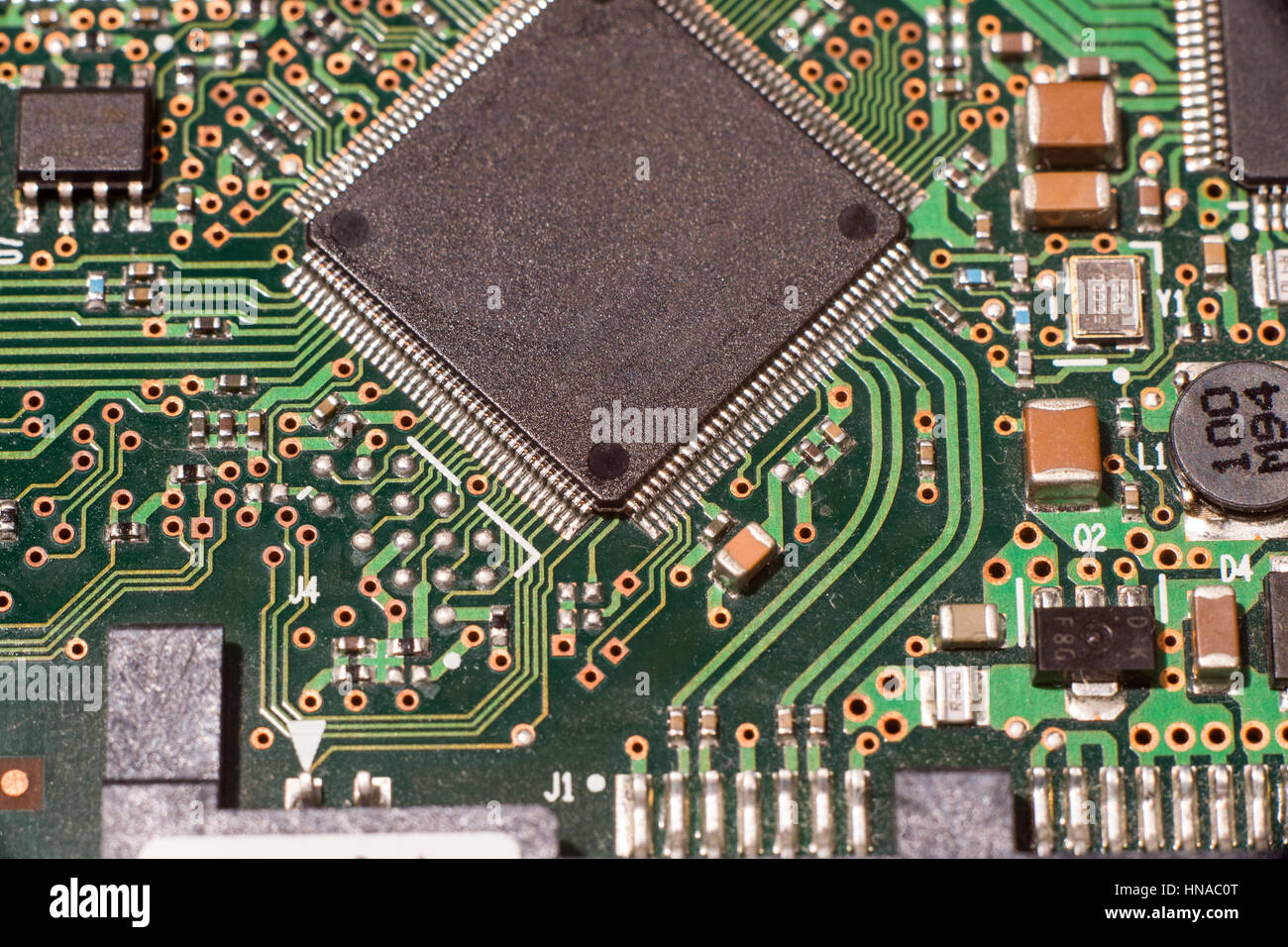 Close up of electronic circuit board with microchip and components Stock Photo