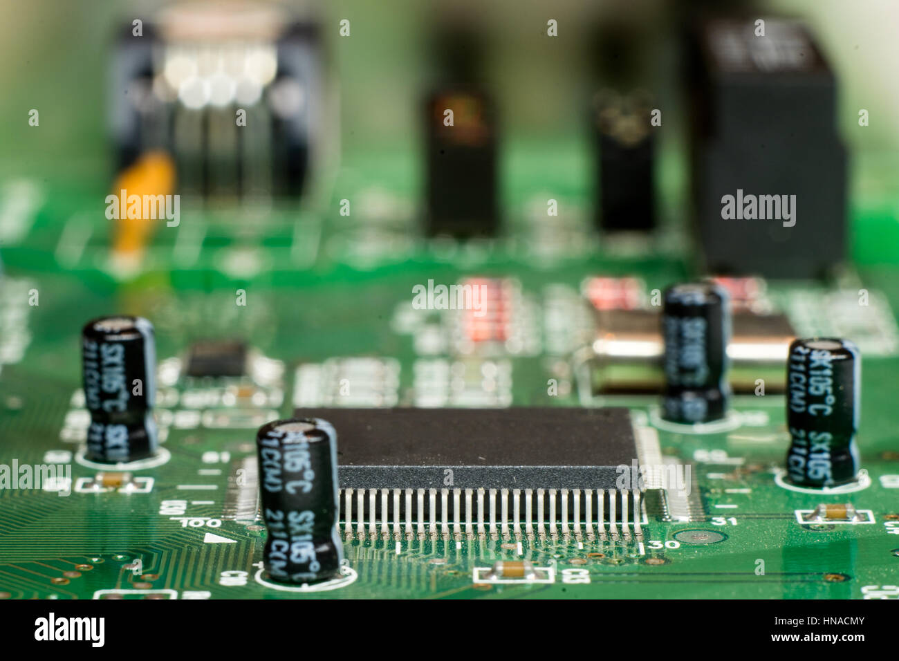 Close up of printed electronic circuit board with microcontroller and components; Stock Photo
