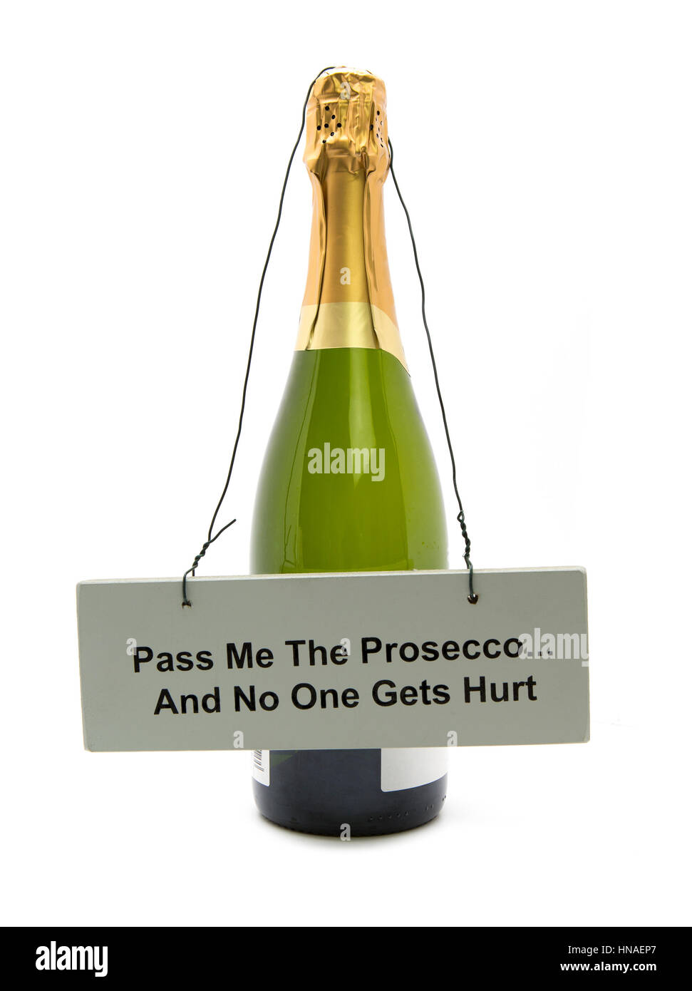Bottle of Prosecco with a sign saying Passme the Prosecco and no one gets hurt on a white background Stock Photo
