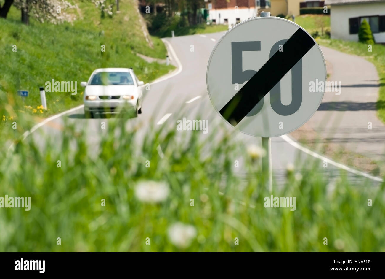 Auto auf Landstra?e, 50km/H Geschwindigkeitsbeschraenkung - car on country road, 50 km/h speed limit Stock Photo