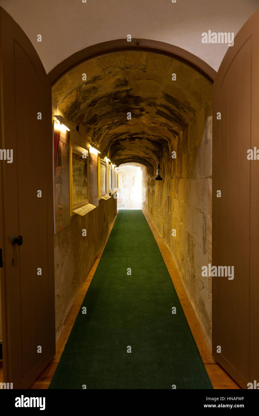 A corridor tunneled through the thick walls of the nineteenth century Fort Rinella in Malta. Stock Photo