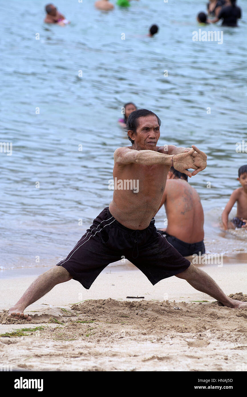 A Youthful Male Practicing Yoga Poses On The Beach During Summer Photo  Background And Picture For Free Download - Pngtree