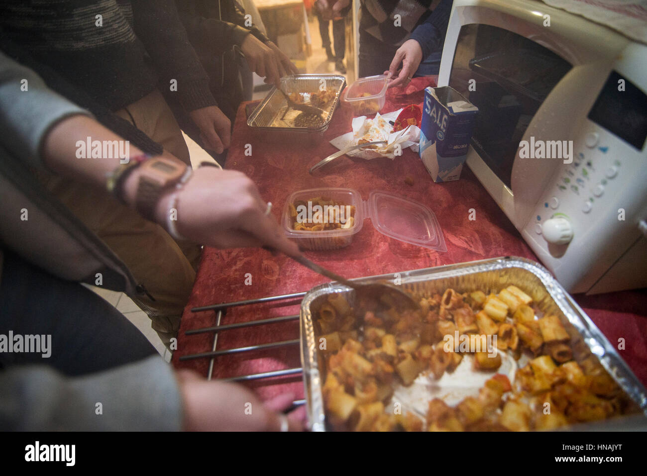 Turin, Italy-29 January 2017: The Community of Sant'Egidio of Turin, which operates around the world, every week for three years distributes and services homeless people in Turin bringing them in person prepared hot meals and blankets to help them how to best face the street life. Stock Photo