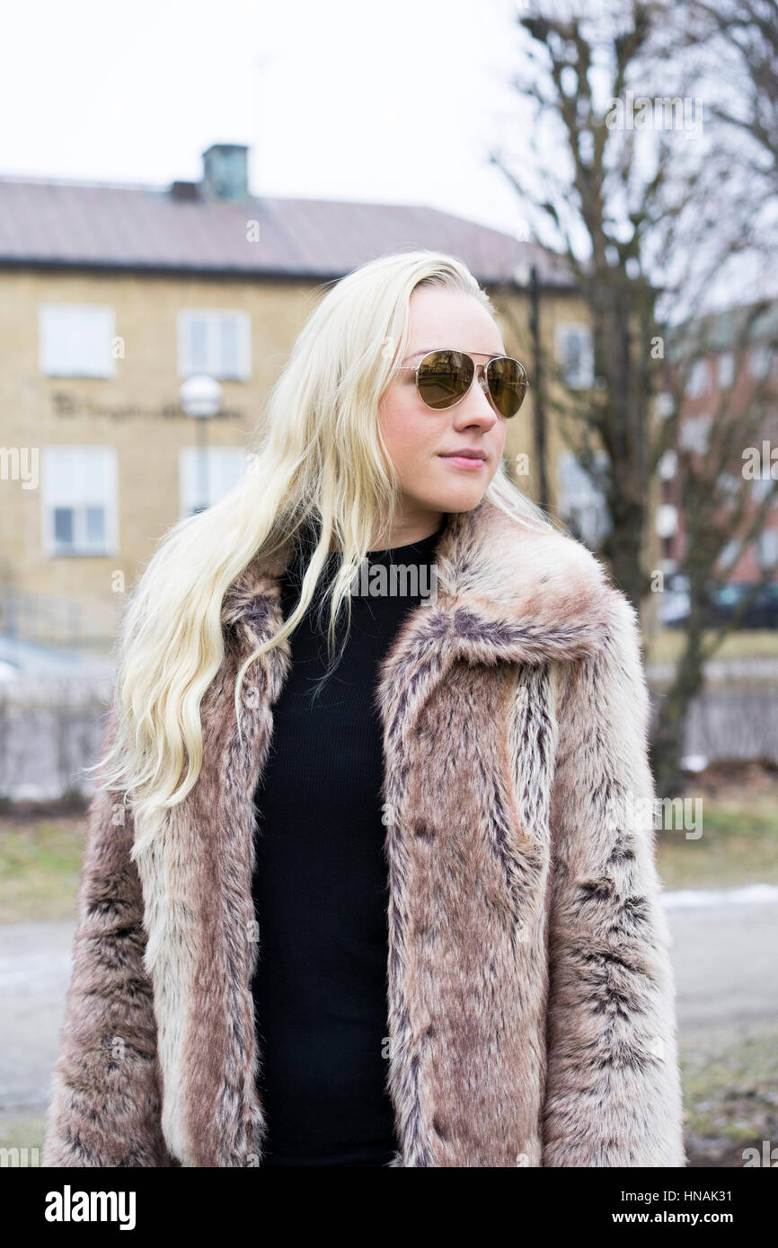 Beautiful Blonde Caucasian Fashion Woman In Fur Coat