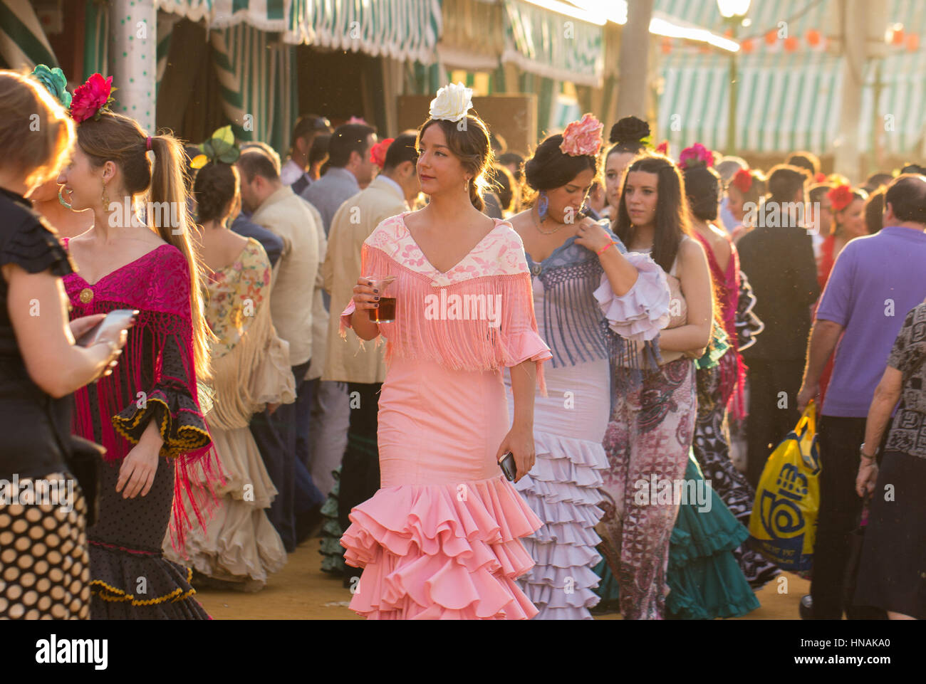 SEVILLE, SPAIN - APR, 25: women dressed in traditional costumes at the Seville's April Fair on April, 25, 2014 in Seville, Spain Stock Photo