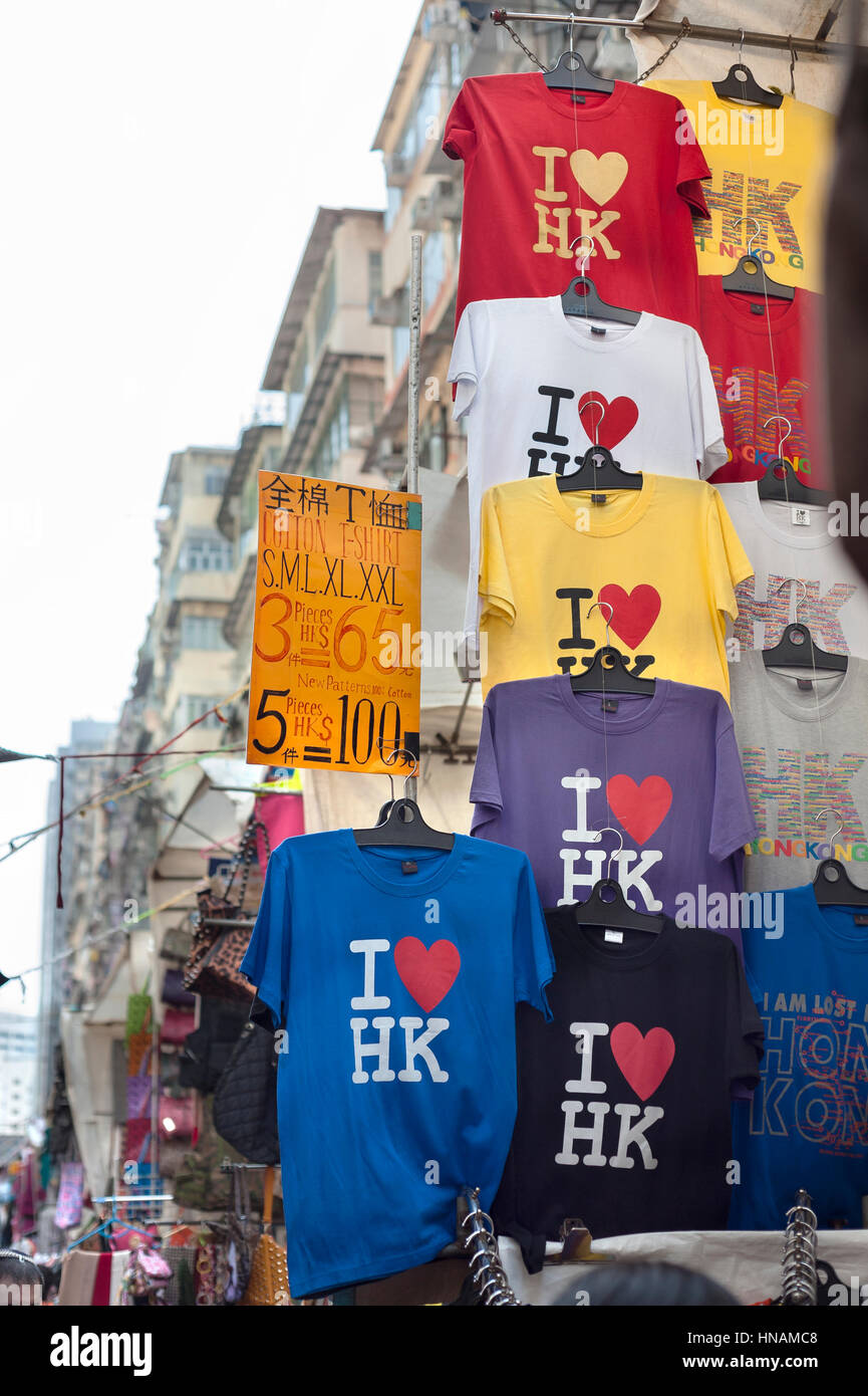 'I love HK' t-shirts hanging at a souvenir stall at the Ladies Market in the Mong Kok area of Kowloon, Hong Kong Stock Photo