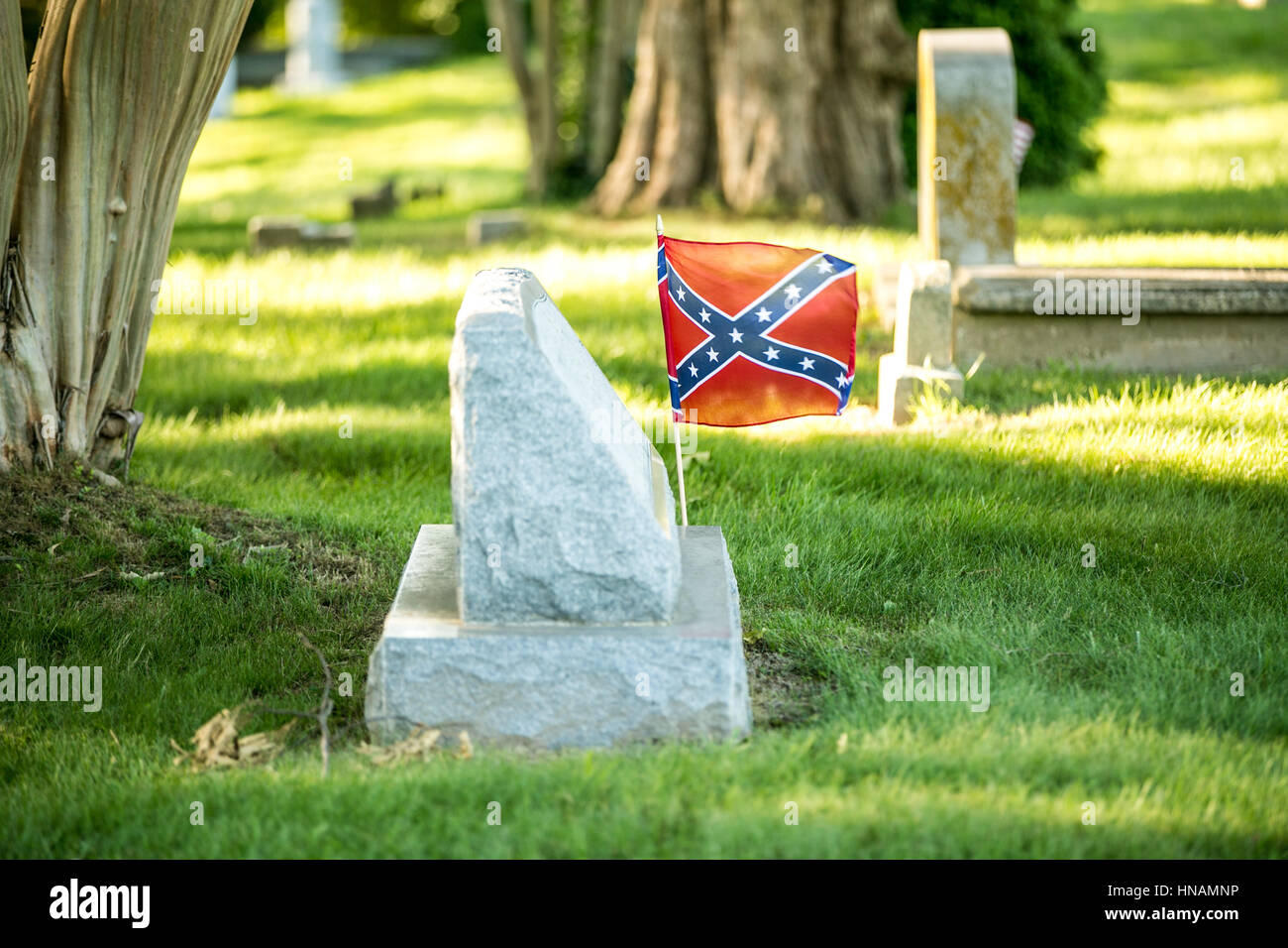 A confederate flag marks a grave stone in southern Maryland Stock Photo
