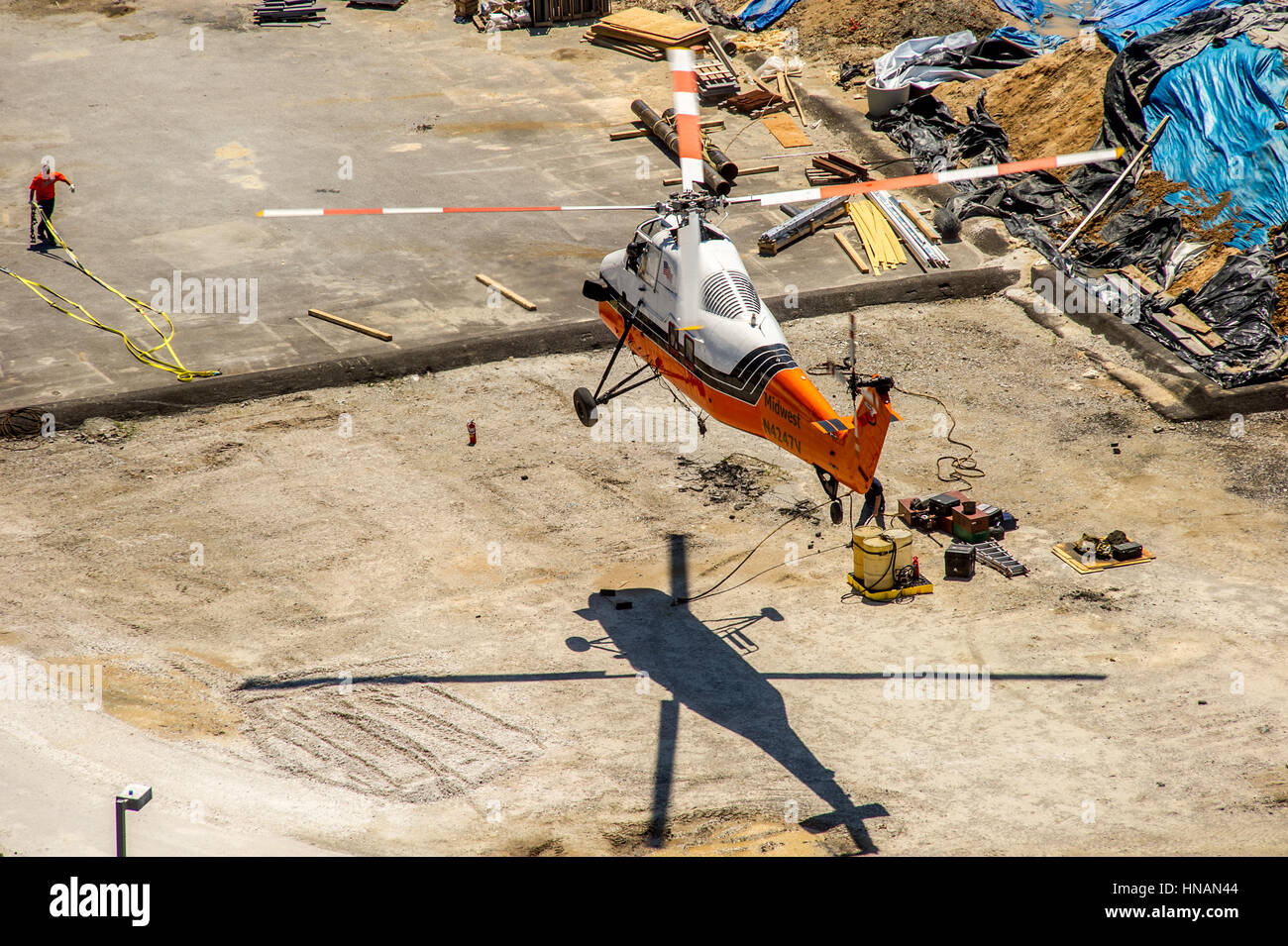 Helicopter air crane lift of AC equipment onto building in Baltimore