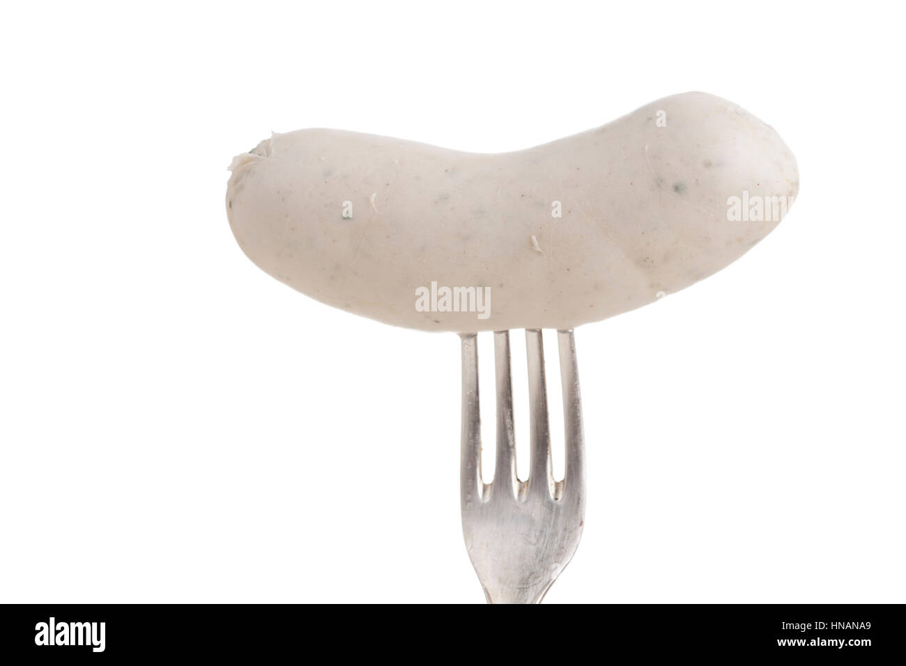 bavarian white sausage on a silver fork Stock Photo