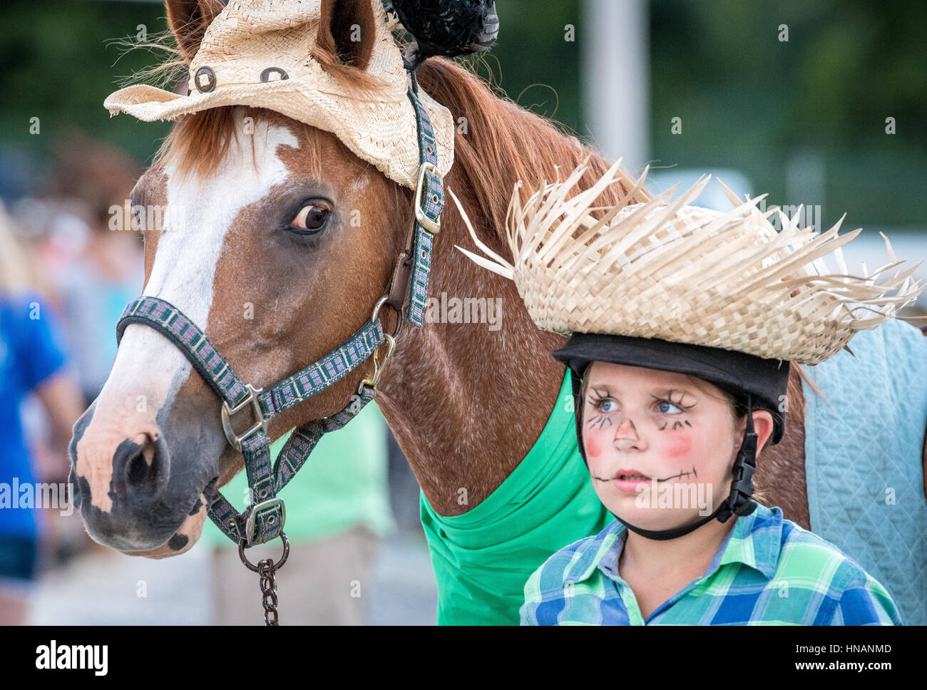 Timonium, Maryland - Young boy and his horse walk together in costume at the 2016 Maryland State Fair. Stock Photo