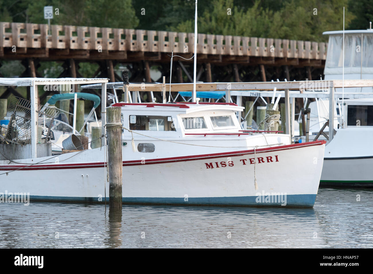 A boat is docked near the Suicide Bridge in Secretary, Maryland. Stock Photo