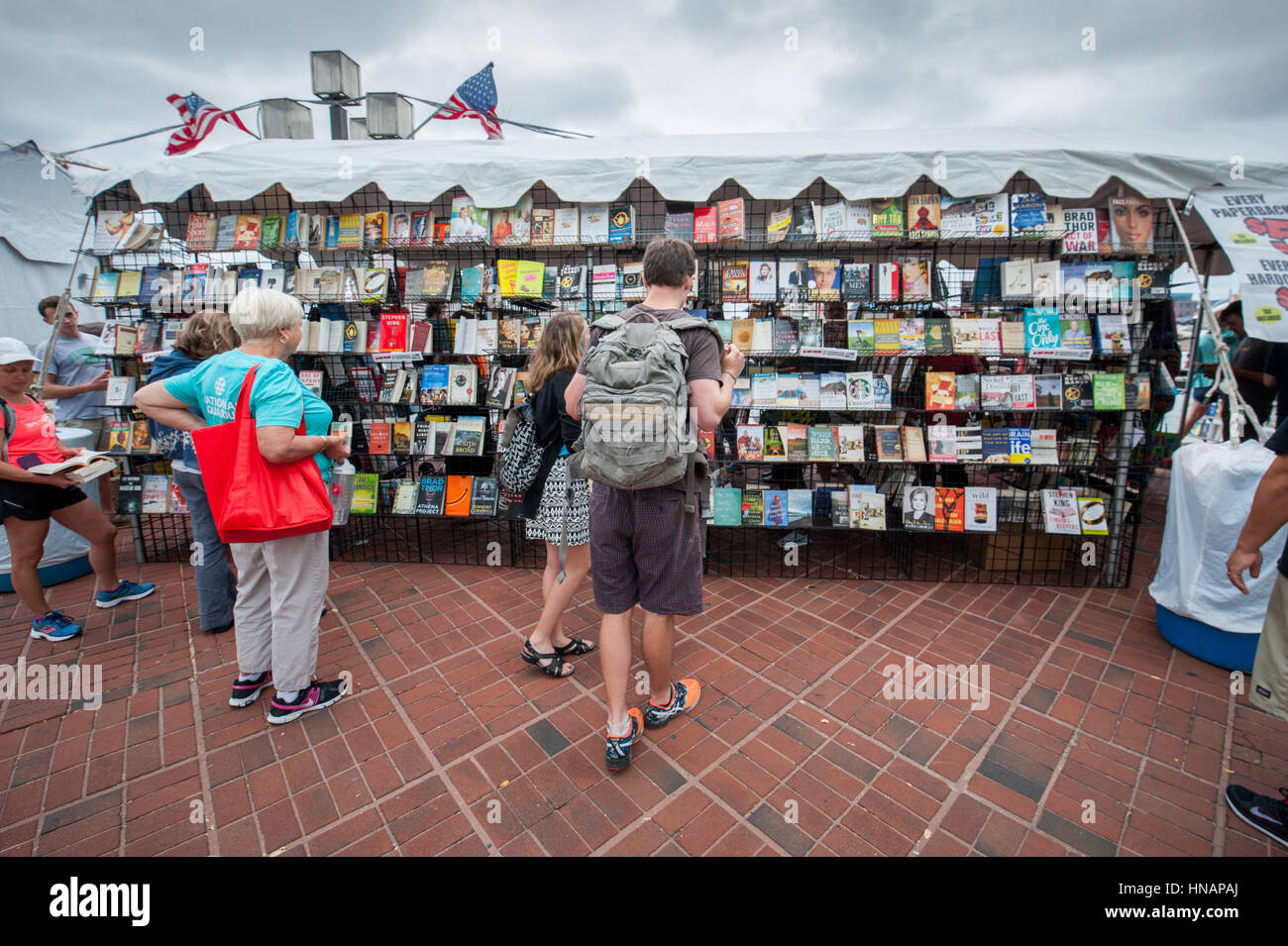 People stop to look at books on display at the Baltimore Book Festival