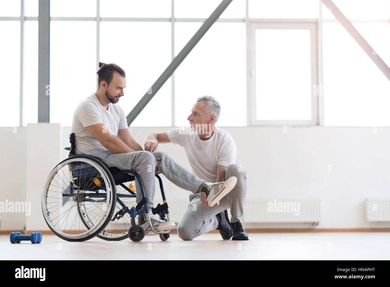 Serious physical therapist providing a healthcare class to the patient Stock Photo