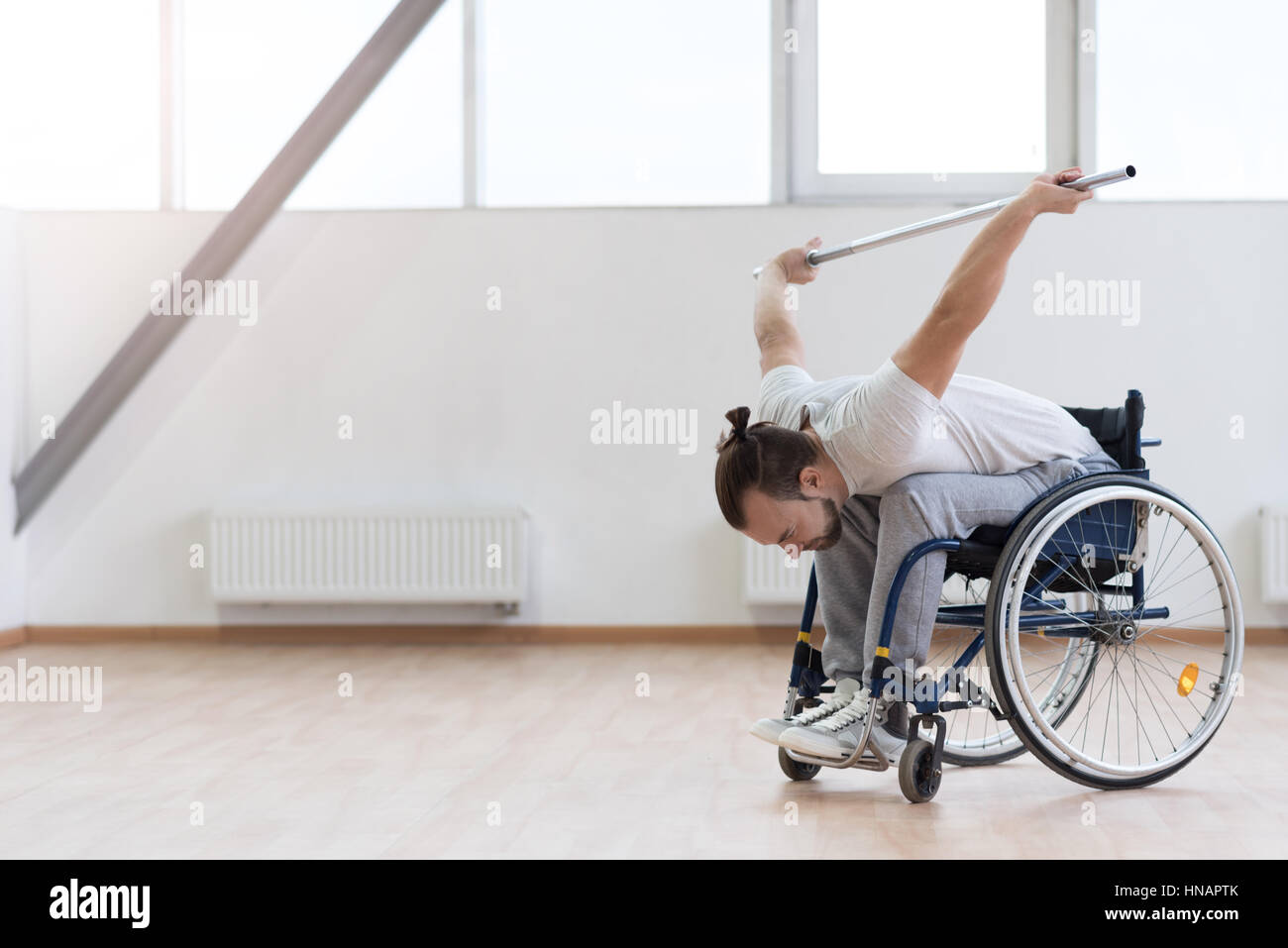 Young handicapped stretching in the gym Stock Photo
