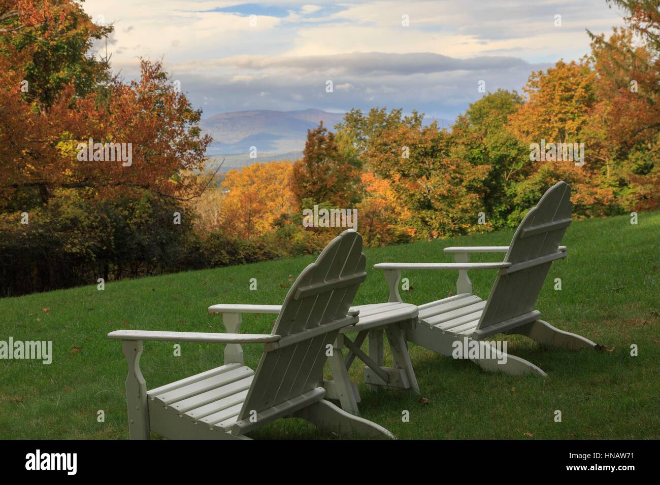 Adirondack chairs looking over Catskill Mountains in Fall, Hudson, New York, USA. Stock Photo