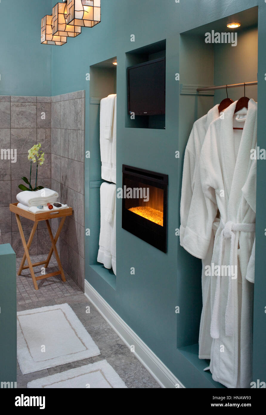 New Bathroom With Electric Fireplace And White Robes Castle In