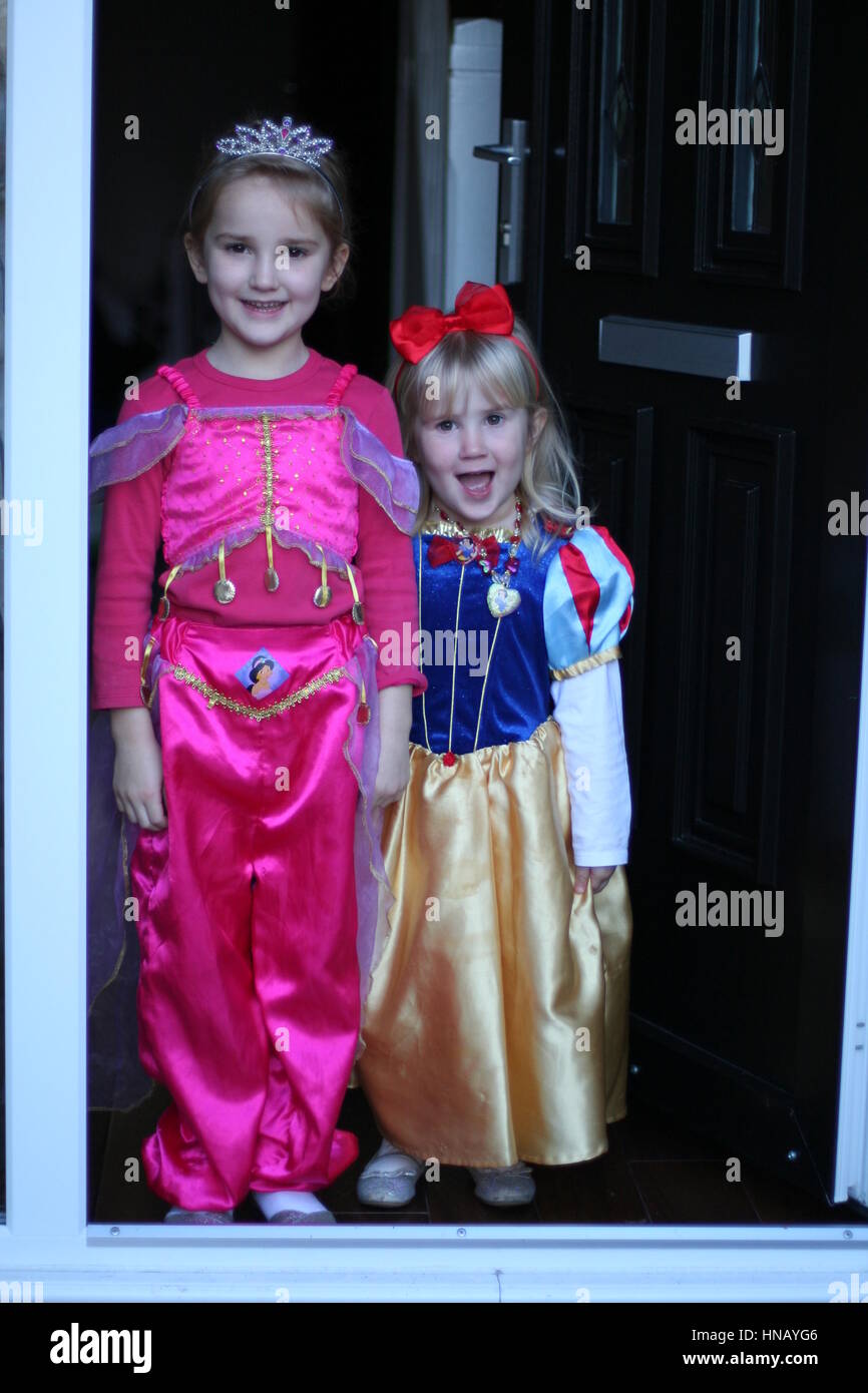 Child Holding A Heavy Carved Pumpkin Wearing A Snow White
