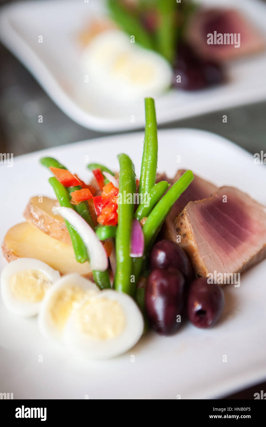 Seared tuna with green beans, olives and eggs Stock Photo Alamy