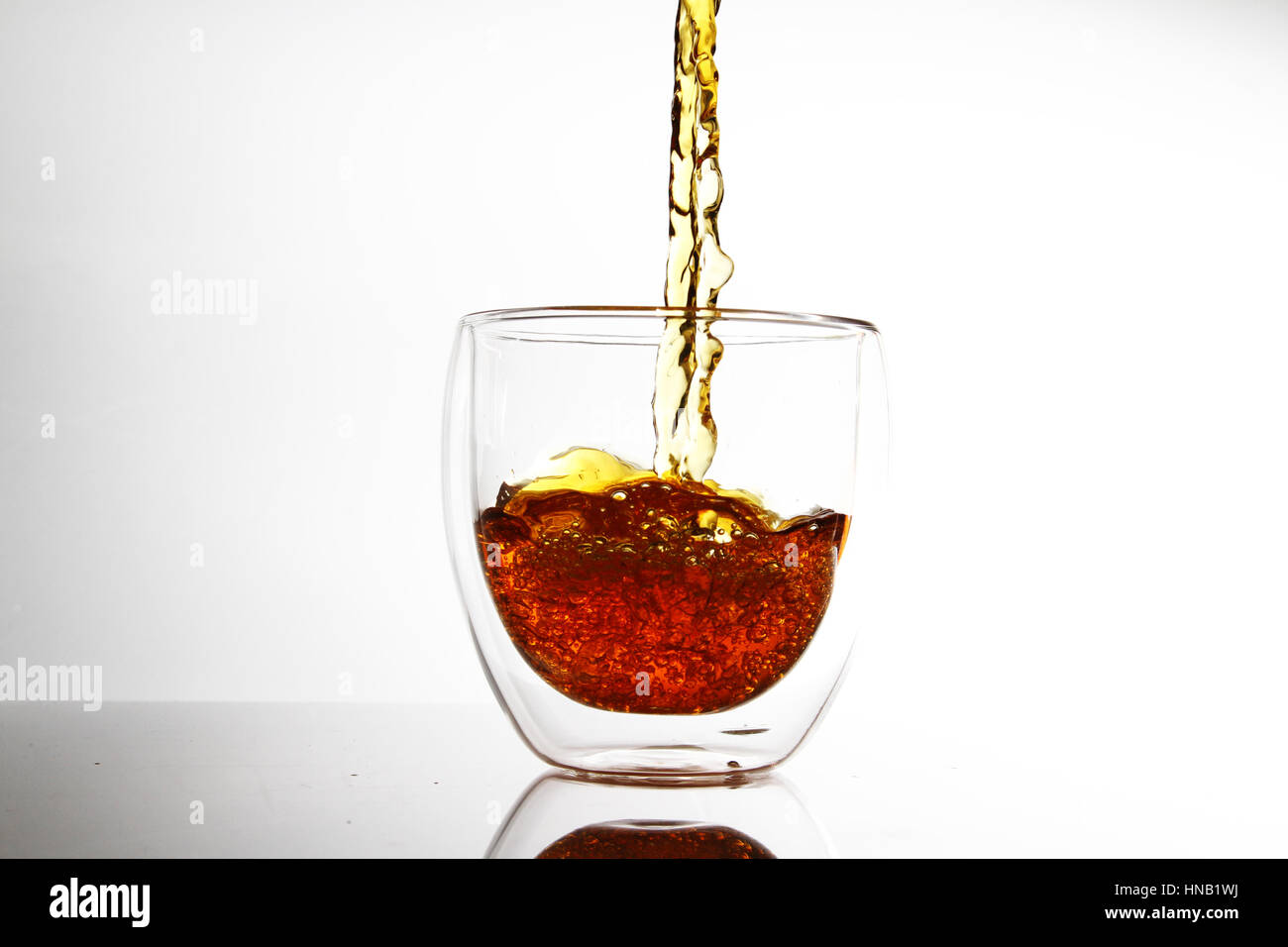 water in transparent glass / A drink or beverage is a liquid intended for human consumption. Stock Photo