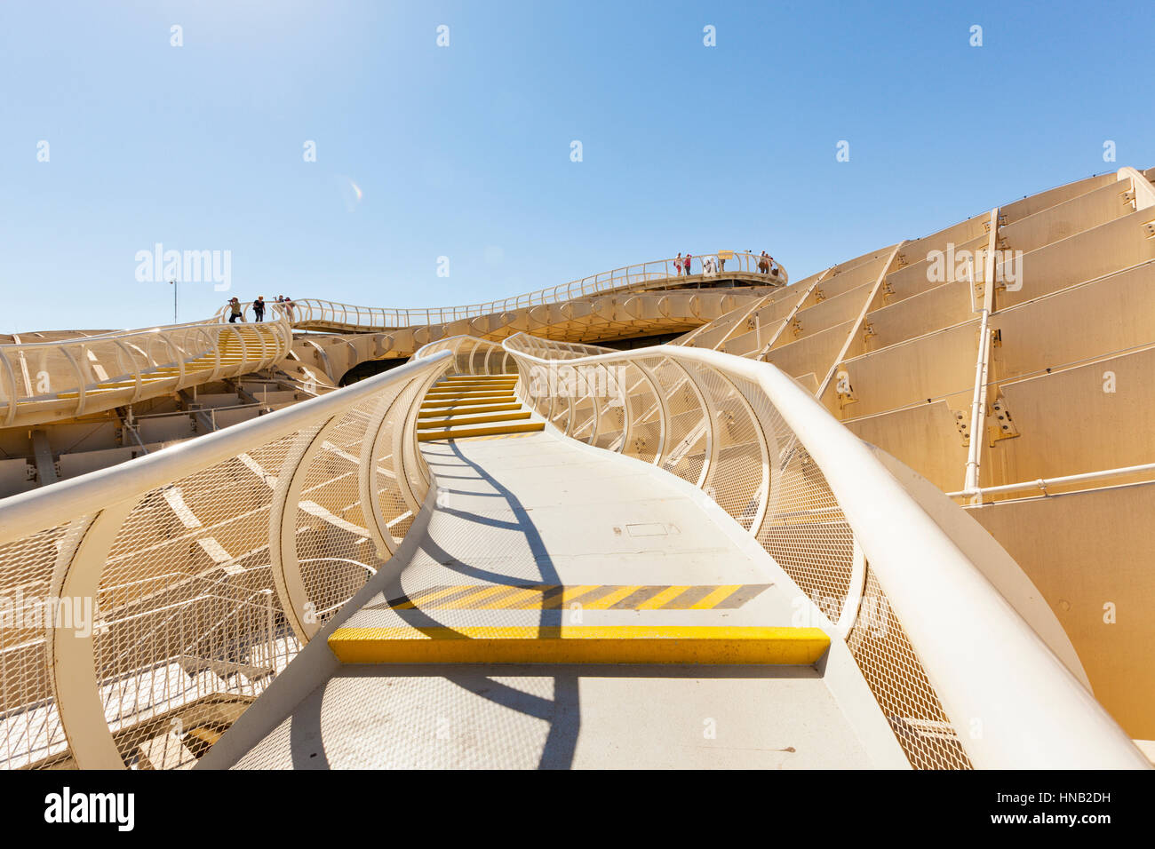 Seville, Spain - May 1, 2016: In bright sunlight people are looking out from the highest point of Metropol Parasol Stock Photo