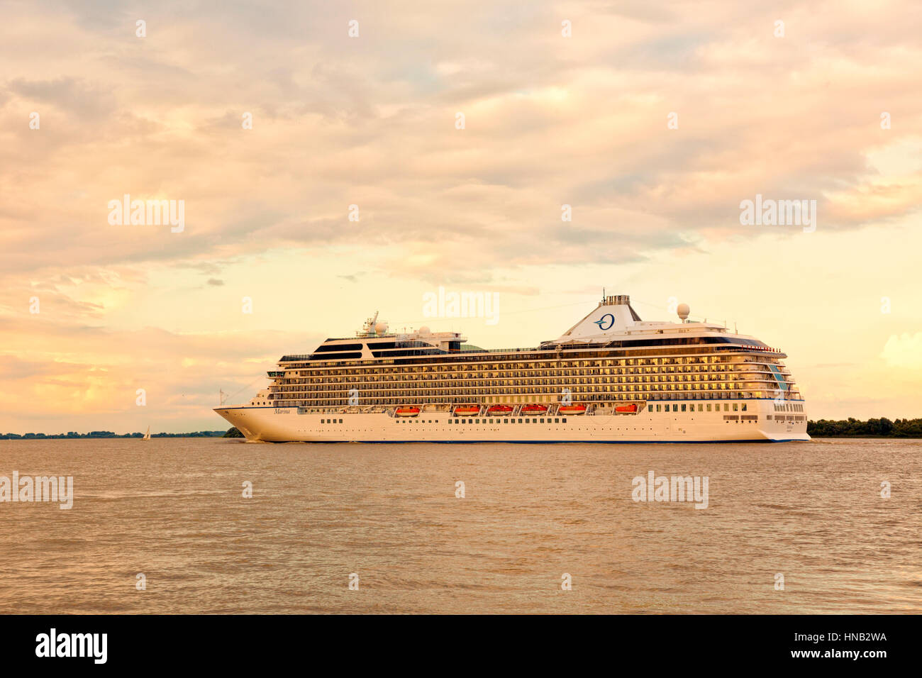 Stade, Germany - August 21, 2016: Cruise ship MS Marina, operated by Oceania Cruises, on the Elbe river near Hamburg. Stock Photo
