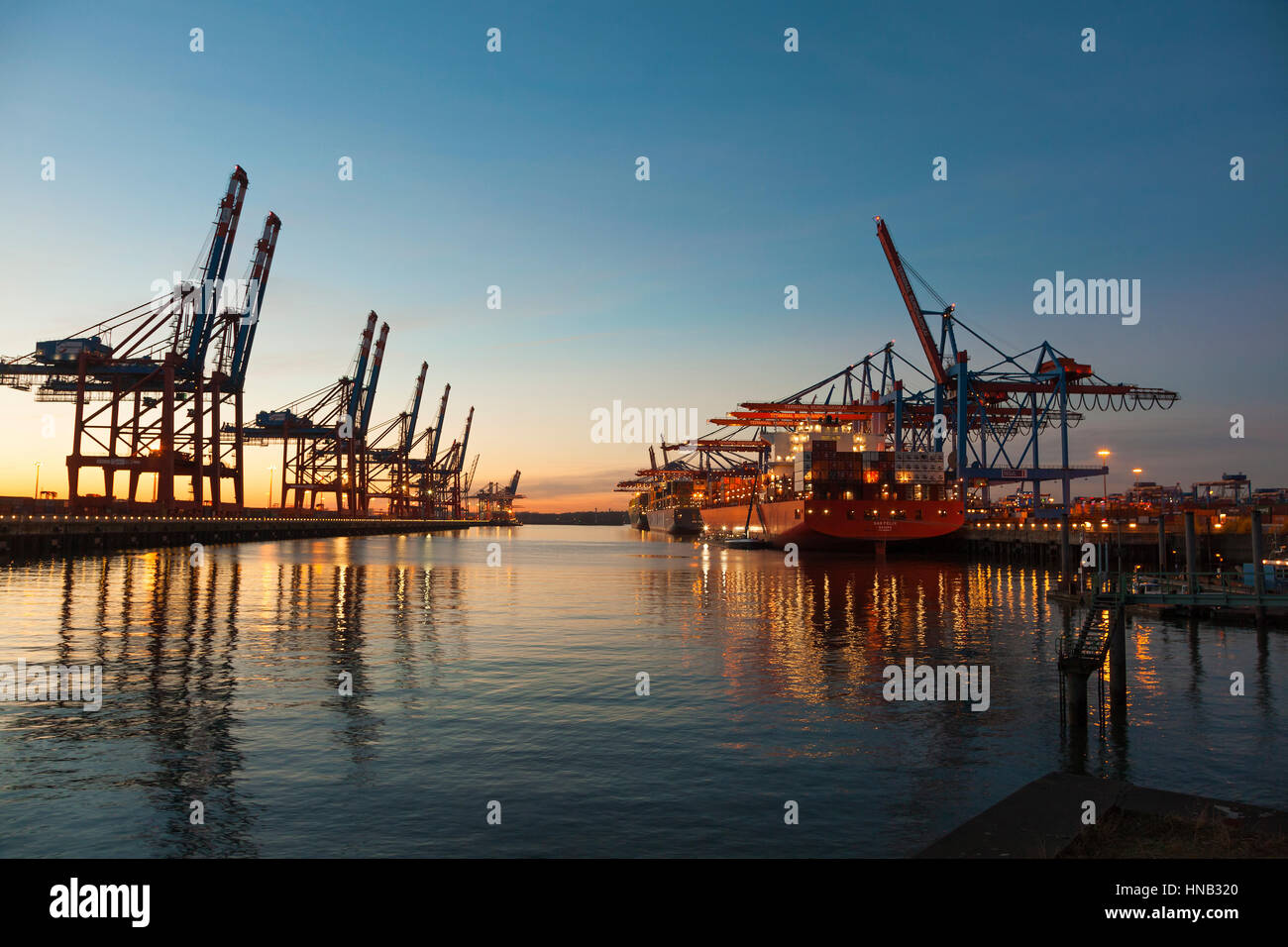 Hamburg, Germany - November 24, 2016: Container terminals at the port of Hamburg, large container ships moored at Burchardkai. Stock Photo