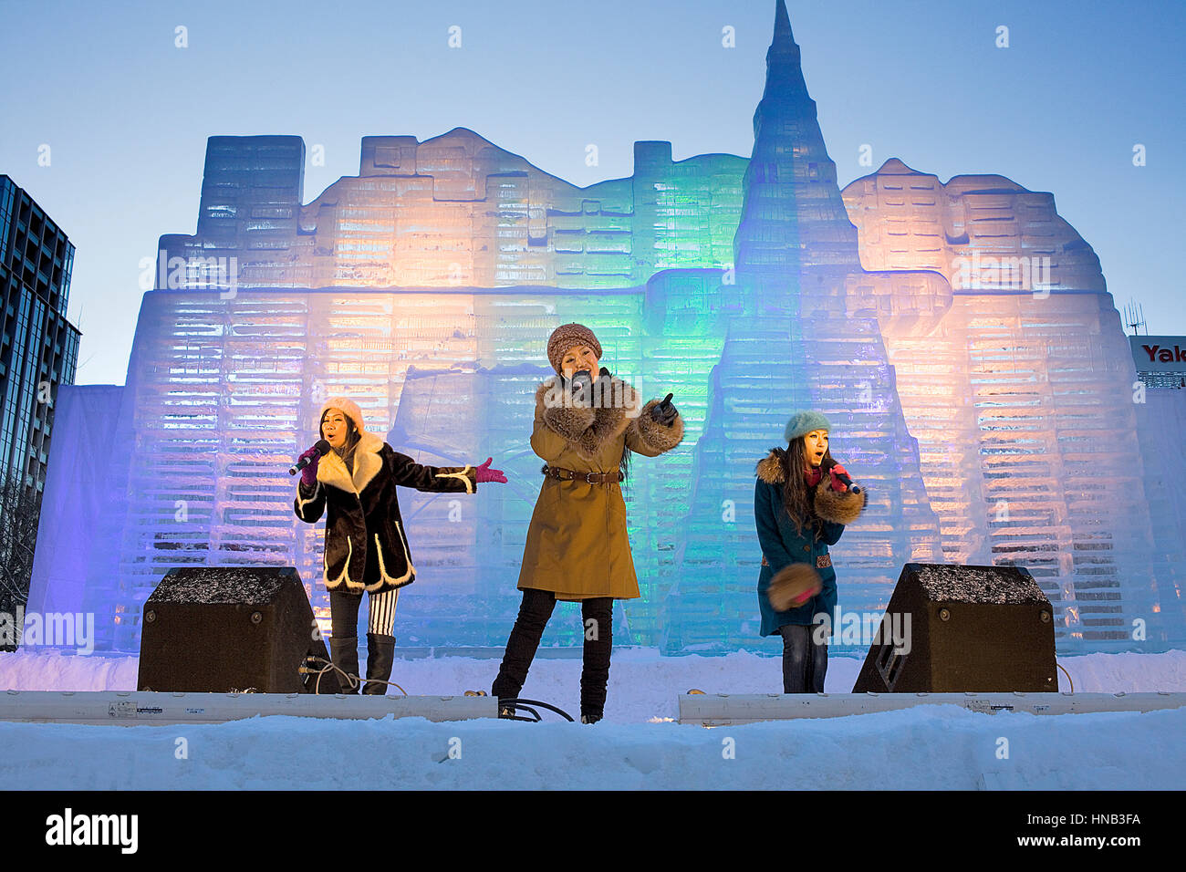 performance,Sapporo snow festival,in background ice sculpture,Odori Park, Sapporo, Hokkaido, Japan Stock Photo