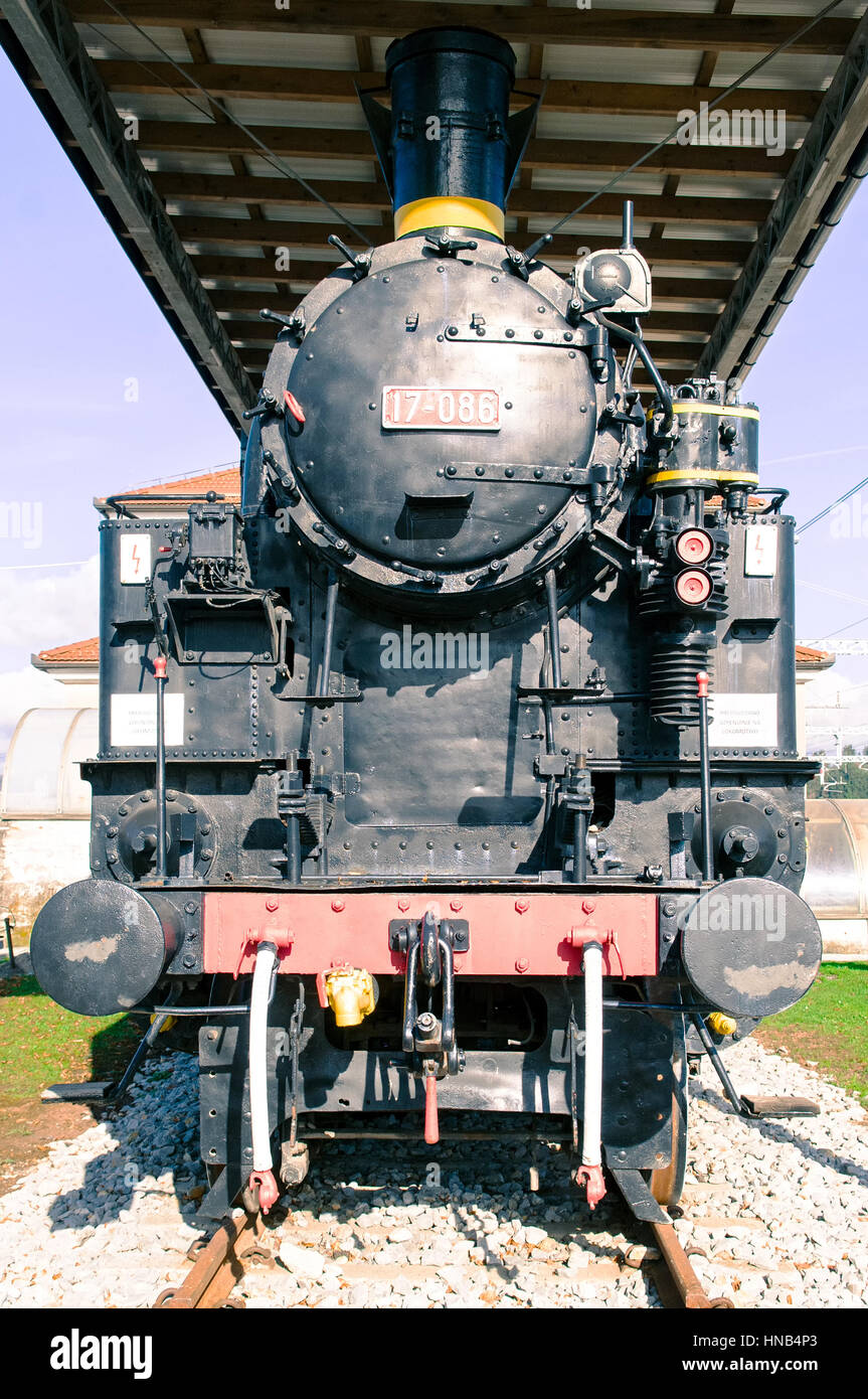 Front side of the old steam locomotive. Stock Photo