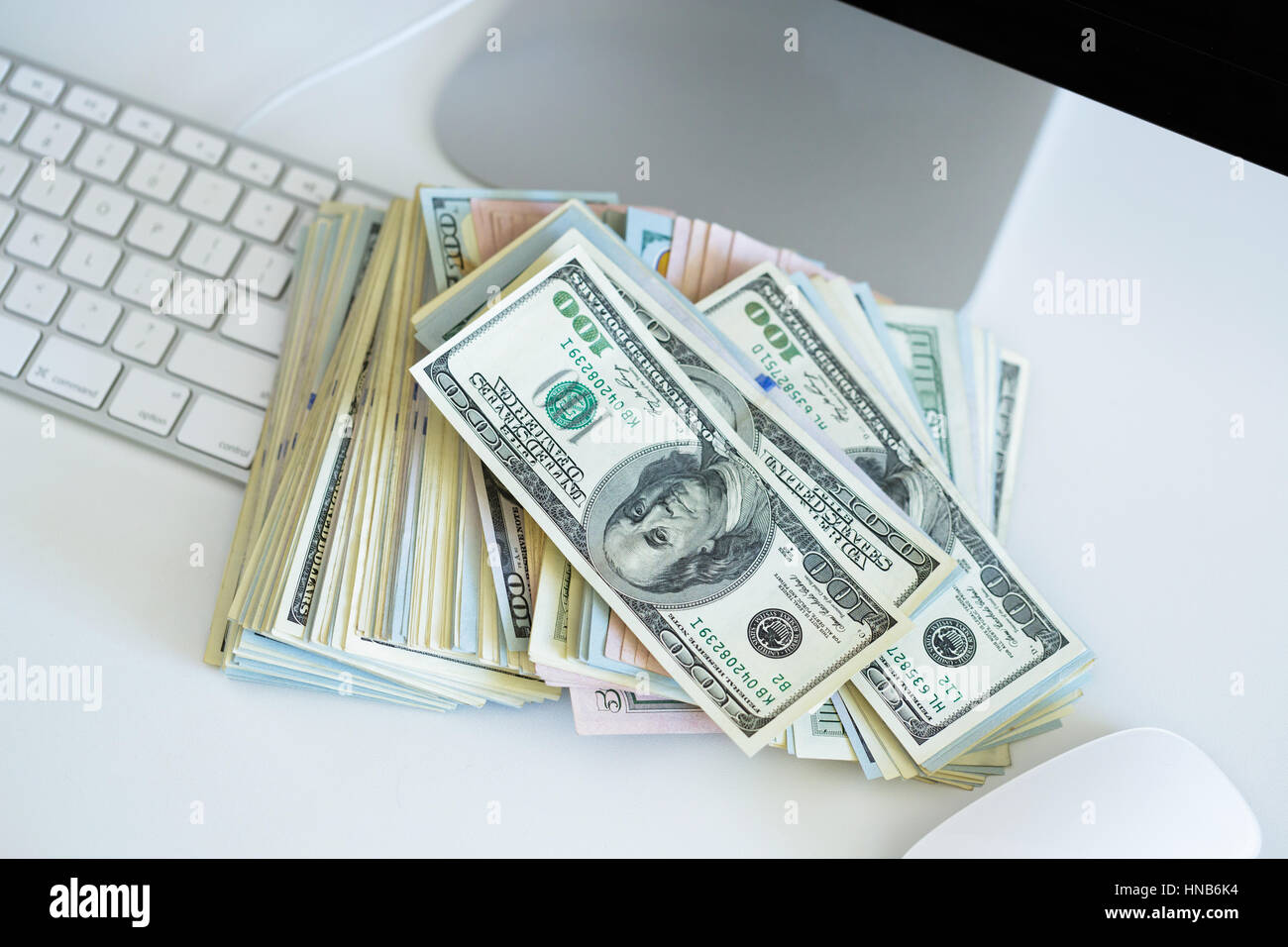 Dollar bills on the white computer keyboard - online payments concept ...