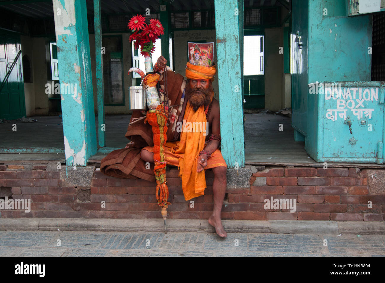 Sadhu in saffron robes at the Swayambhunath pagoda, Kathmandu, Nepal who claims to be from the