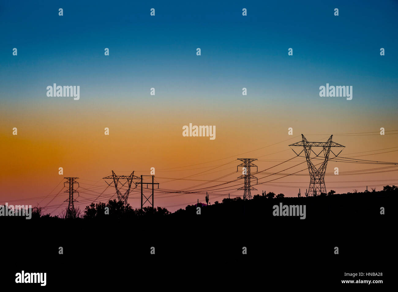 Transmission lines power grid sunset Stock Photo