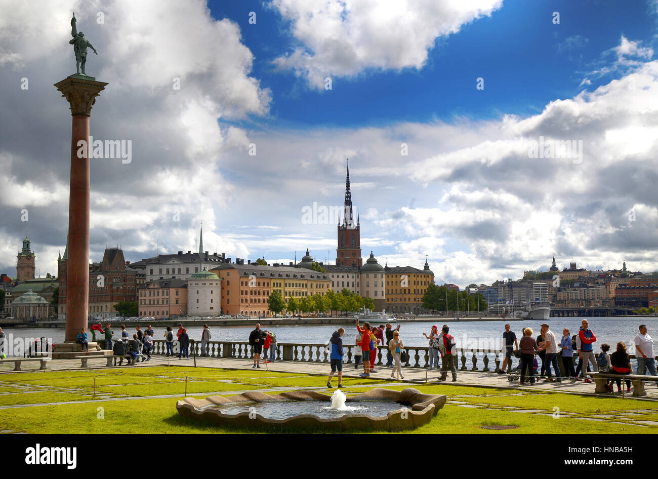 STOCKHOLM, SWEDEN - AUGUST 19, 2016: Tourists walk and visit Stockholm City Hall ( Stadshuset ) and View of Gamla Stan in Stockholm, Sweden on August  Stock Photo