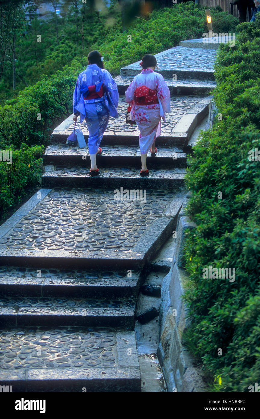 women, woman, quimono,  wearing kimono, they are walking up the stairs to the Ryozen Kannon temple, Kyoto, Japan Stock Photo