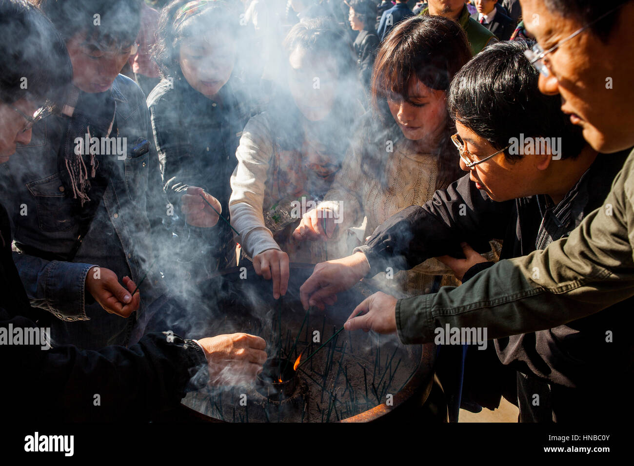 People burning incense, in Kiyomizudera temple, Kyoto. Kansai, Japan