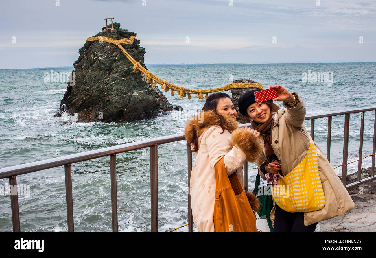 Selfie, Tourists,Meoto-Iwa, Wedded Rocks, off the coast of Futamigaura Beach, Futami Town on the in Mie Prefecture, Japan. Stock Photo