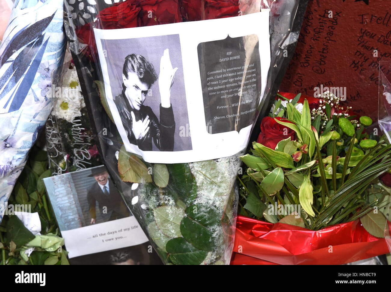 Tributes are laid at the mural of David Bowie in Brixton, south London, on the first anniversary of the death of Bowie, who died at the age of 69 after a battle with cancer.  Featuring: Atmosphere Where: London, United Kingdom When: 10 Jan 2017 Credit: WENN.com Stock Photo