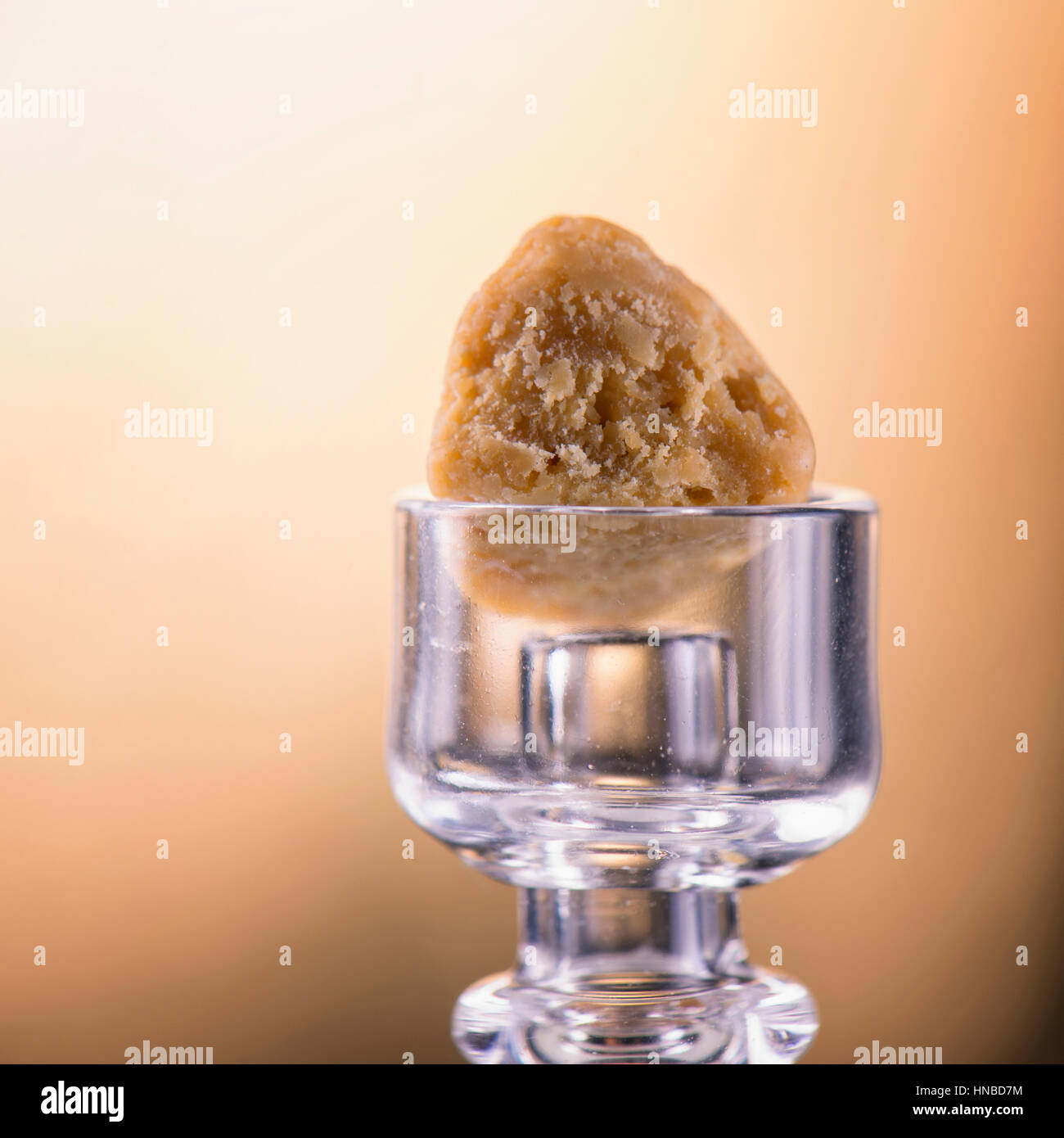 Macro detail of a single piece of marijuana extraction concentrate aka ...