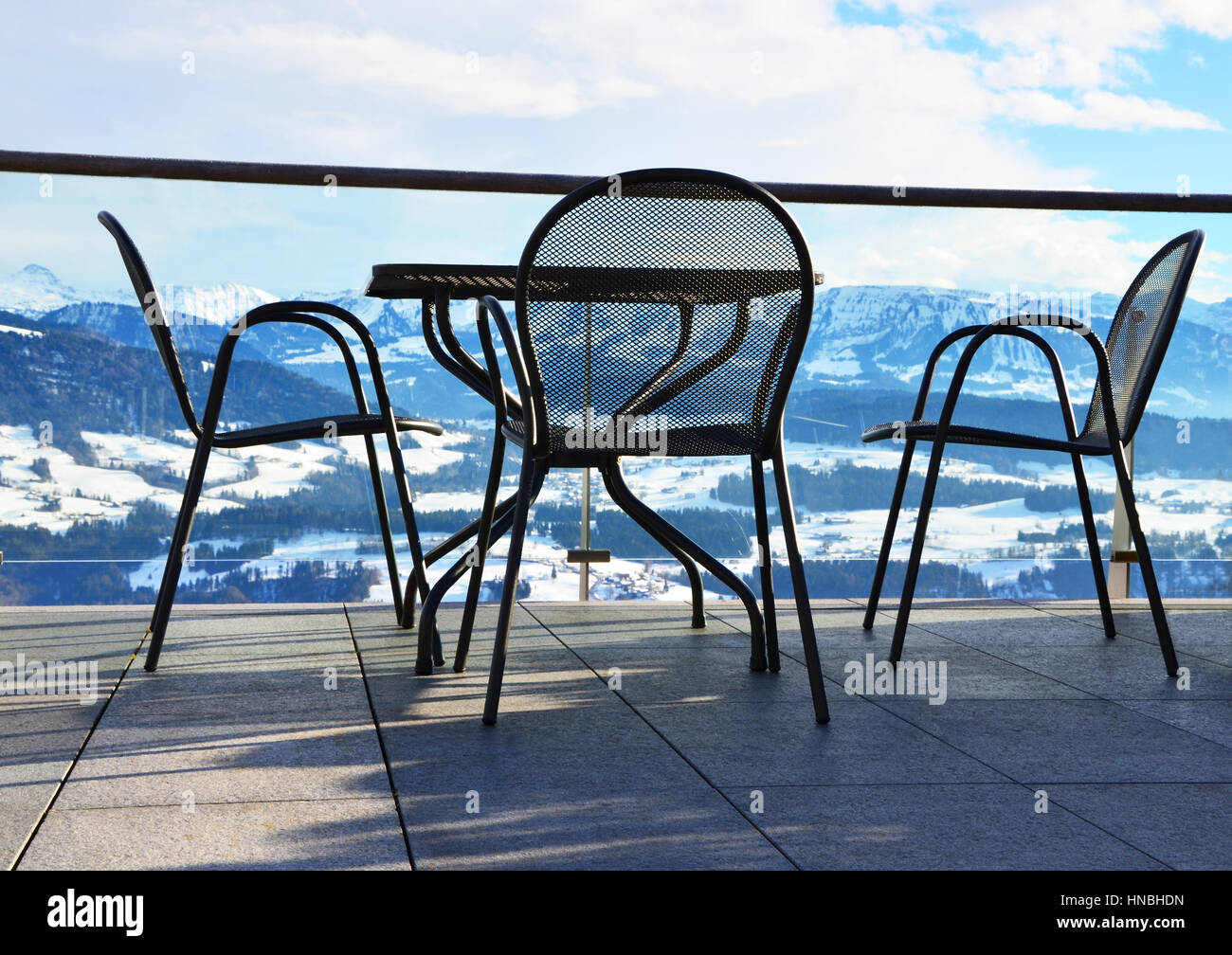 Chairs and Table with view of Allgaeu Alps (Allgäu Alps), as seen from Sulzberg, Vorarlberg, Austria Stock Photo